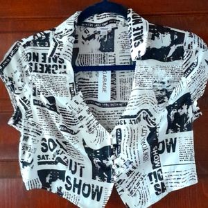 Newspaper print blouse. Short sleeves,button front.